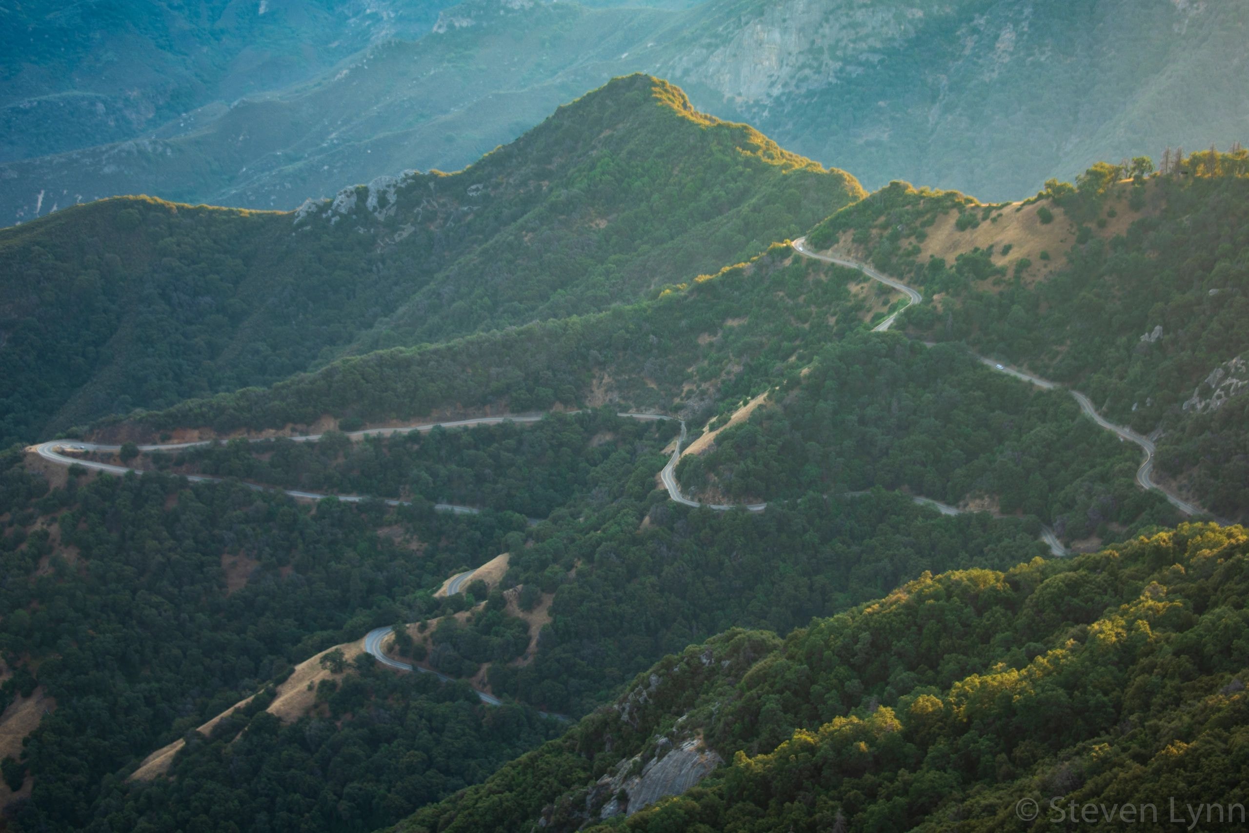 Winding mountain road representing the pharmaceutical quality journey